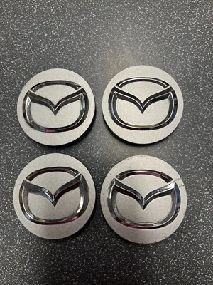 Tapacubos central rueda Mazda 626 Protege Millenia 1995-08 tapacubos OE 2477 Foto 1 de 2