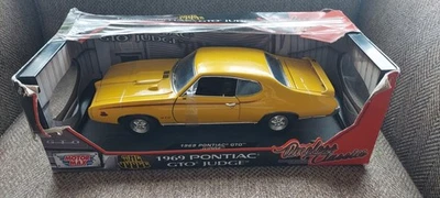 1969 Pontiac GTO Judge Yellow 1/18 Diecast Model Car by Motormax - Image 1 of 4