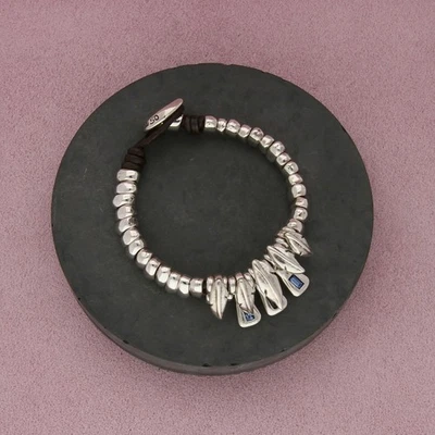 Pulsera de cuero plumas cristal azul chapado en plata uno de 50 talla 7 pulgadas Foto 1 de 3