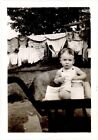 BABY in WHEELBARROW near CLOTHESLINE SNAPSHOT PHOTO c. 1940s