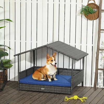 Casa elevada de mimbre para perros, cama de ratán para mascotas con cojín y dosel para interiores y exteriores Foto 1 de 4