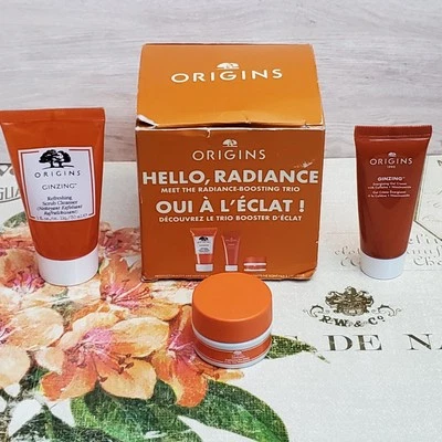Origins HELLO RADIANCE Boosting Trio Set Ginzing Exfoliante Crema de Ojos Gel Crema Foto 1 de 4