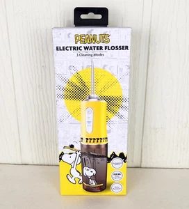 Peanuts Snoopy hilo dental eléctrico recargable perfecto para aparatos ortopédicos amarillo nuevo en caja - Imagen 1 de 11