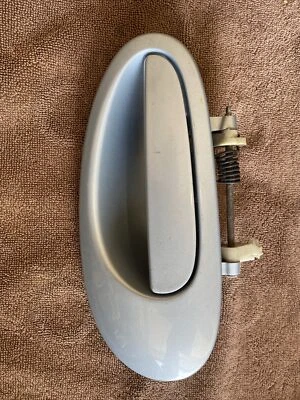 Manija exterior puerta izquierda conductor trasero Chrysler Sebring 2001-2006 OEM 00A51TMAD Foto 1 de 2