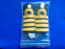 A PAIR OF NEW ROYAL NAVY CAPTAINS SHOULDER BOARDS