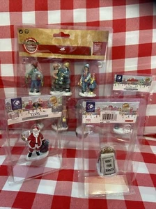 Lumineo Pueblo de Navidad Conjunto de Aldeanos Familiares Letrero de Pueblo de Santa y Un Marco - Imagen 1 de 24