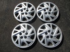 Genuine 2000 to 2005 Pontiac Sunfire bolt on 14 inch hubcaps wheel covers nice