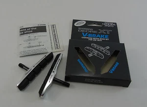 Pastillas y soportes de freno en V Shimano XT, un par, compuesto de llanta de cerámica, totalmente nuevos - Imagen 1 de 2