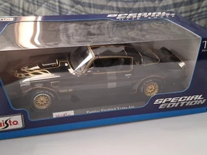 Maisto 1/18 Pontiac Firebird Trams Am Black / Gold - Picture 1 of 4