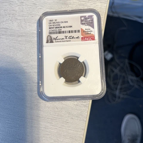 1865 2C NGC AU53 BN Mint Error On Reverse Die Breaks On The Rim Signed Cabral Cover