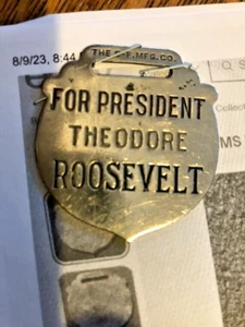 RARO 1904 PARA PRESIDENTE THEODORE PLACA DE METAL LLAVERO C-F MFG CO - Imagen 1 de 3