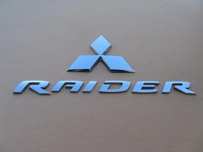 06 07 08 09 10 11 MITSUBISHI RAIDER REAR GATE EMBLEM LOGO BADGE SIGN USED A47065 - Image 1 of 4