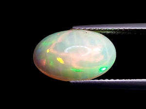2.920CTS  Rainbow multi color flashing black natural Ethiopian opal oval shape - Picture 1 of 2