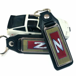 Key Fob Key Ring Keychain For Nissan 300ZX Z31 Steering Wheel Emblem (2-Pack) - Picture 1 of 4
