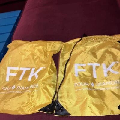 2 bolsas con cordón FTK de cuatro diamantes amarillos y blancos Foto 1 de 4