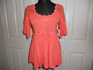 NWT FREE PEOPLE BABY DOLL LACE TRIM TOP CORAL IN SIZES XSMALL & SMALL - Foto 1 di 18