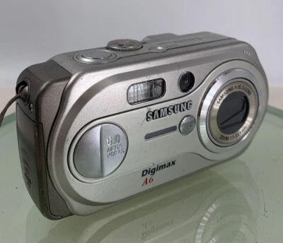 Samsung DIGIMAX COMPACT DIGITAL CAMERA A6 NOCARD NO CHARGER SILVER TESTED - 550 - Image 1 of 4