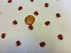 1 half metre polycotton with small ladybirds in red and black on white