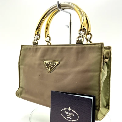 Auténtico bolso de mano PRADA de nailon con asa de metal de Japón Foto 1 de 4