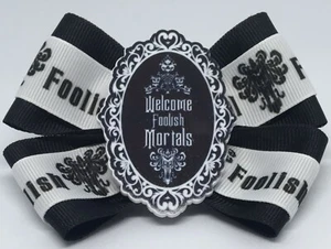 "Arco de pelo para niñas de 4" de ancho The Haunted Mansion Bienvenido Foolish Mortals" clip para cabello - Imagen 1 de 2