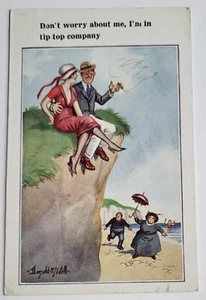 C 1930 LOVE & ROMANCE PC A/S DONALD MCGILL HUMOR COUPLE PERCH ON CLIFF AT BEACH - Picture 1 of 2