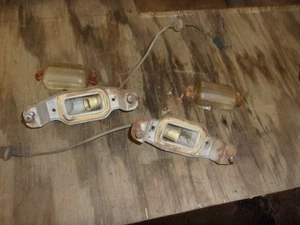 1966-72 GM chevy Impala rear bumper liscense plate lights pair - Foto 1 di 6