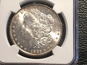 1885 Morgan Dollar NGC 64 Unc. Bright Light Gold Toning. - Picture 1 of 7