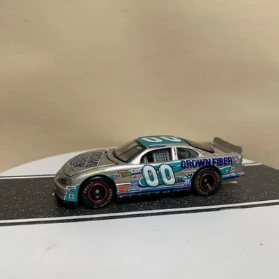 1999 Racing Champions NASCAR #00 Crown Fiber Buckshot Jones Silver/Blue 1:64 NM - Image 1 of 4