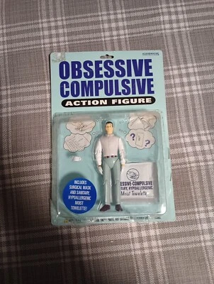 Figura de acción obsesiva compulsiva que incluye máscara facial y toalla húmeda abierta Foto 1 de 4