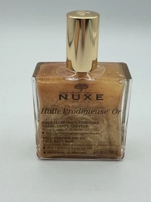 Aceite Nuxe Huile Prodigieuse O Golden Shimmer para rostro, cuerpo y cabello 100 ml 3,3 oz Foto 1 de 3