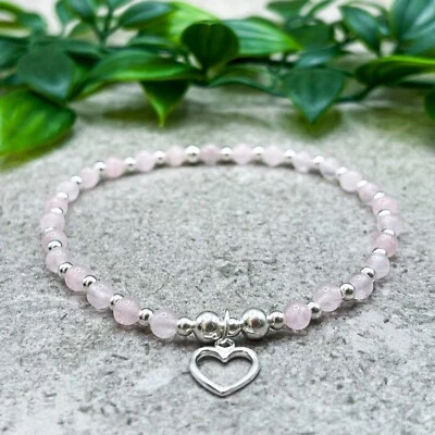 Pulsera elástica de plata de ley y cuarzo rosa con cuentas de cristal con dije de corazón Foto 1 de 4