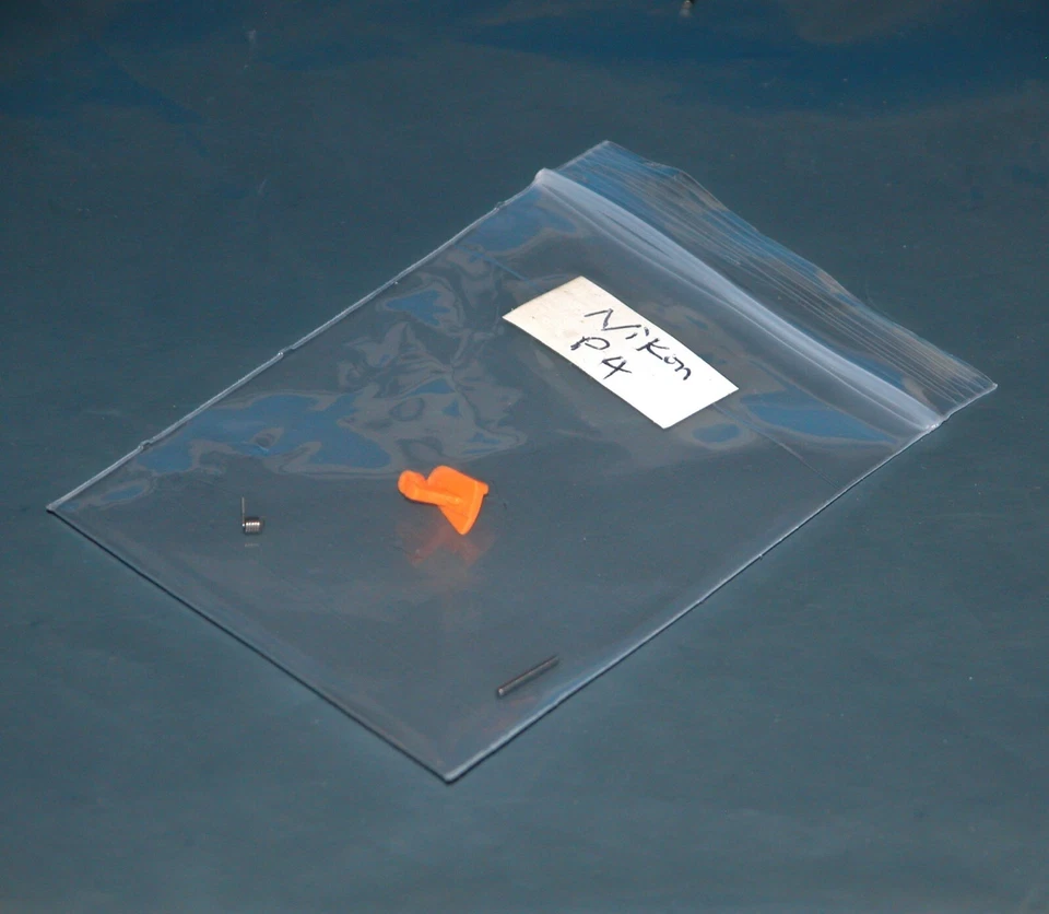 Cierre/tapón de batería para cámara digital Nikon Coolpix P4 - Piezas de repuesto Foto 1 de 1