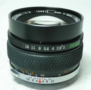 Olympus OM Zuiko Auto-W 2,0 35mm Objektiv An-Verkauf ff-shop24 - Bild 1 von 5
