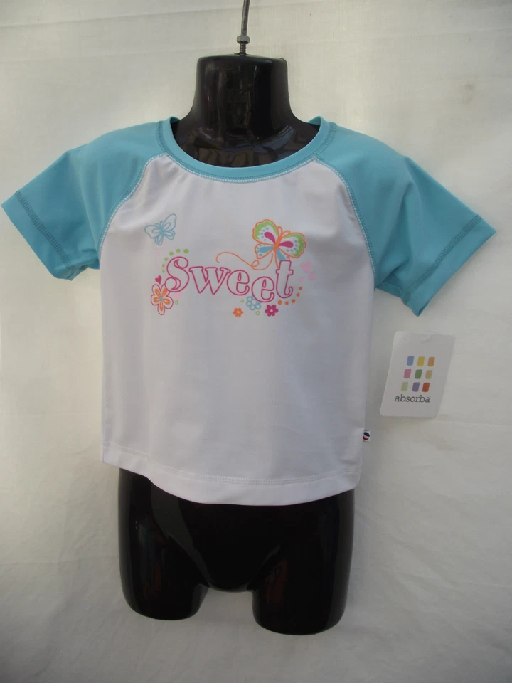 Nuevo con etiquetas Chaleco Absorba Aqua y Blanco Manga Corta Erupción Niñas Tallas 1 2 3 y 4 Años Foto 1 de 3
