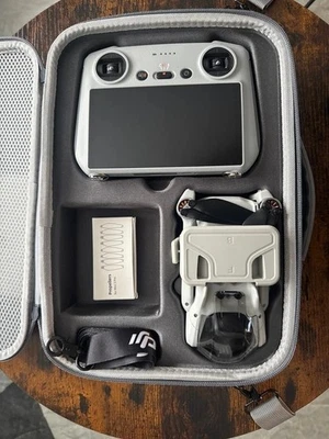 DJI Mini 3 Camera Drone (with RC Remote) - BARELY USED - RRP £459 - Image 1 of 4