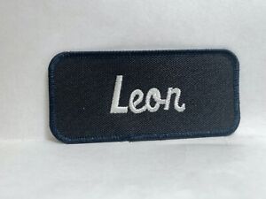 LEON USED EMBROIDERED VINTAGE SEW ON NAME PATCH TAGS BLUE ON GREY