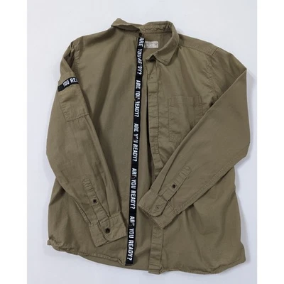 Camisa de manga larga con botones ZARA con ribete de eslogan para niño talla 11/12 años  Foto 1 de 4