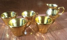 Gold coffee cups 2 x 2.5 and a creamer, set of 4, never used, porcelain