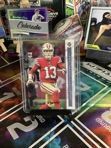2022 Panini Chronicles Luminance PINK #213 BROCK PURDY Rookie RC - Bild 1 von 2