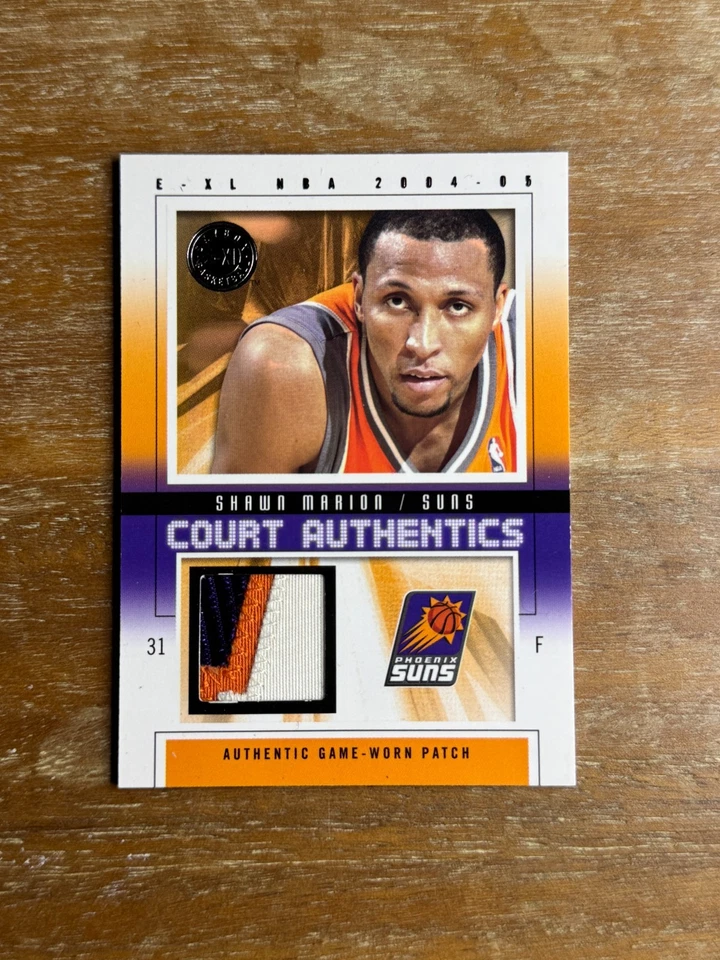 SHAWN MARION 2004-05 FLEER E-XL 法院授权比赛穿补丁/70 太阳 — 第 1/2 张图片