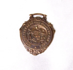 RELOJ BOLSILLO VINTAGE SELLO ESTADO DE NUEVA YORK LLAVERO PLACA ORO 14 KT en BRONCE - Imagen 1 de 2