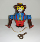 altes mechanisches Blechspielzeug Affe mit Springseil