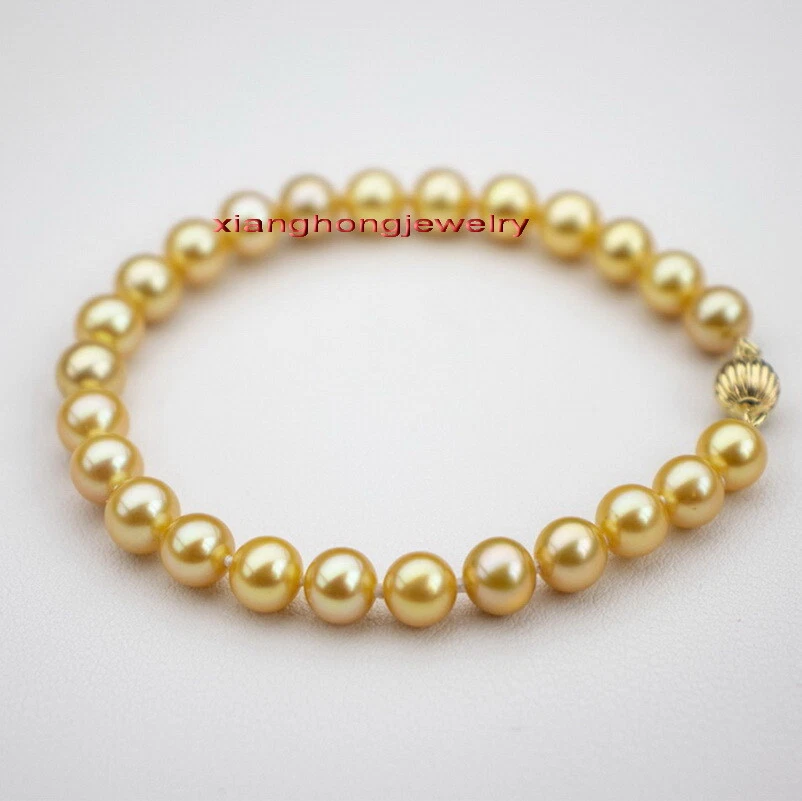 AAAAA 7.5"10-11mm Natural real round south sea golden pearl bracelet 14K GOLD - Image 1 of 4