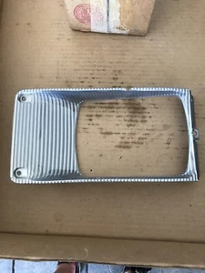 1661763C1 New OEM International Headlight Bezel, LH - Picture 1 of 12