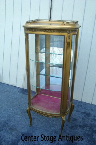 61738 Gold Bow Glass Lighted Curio Cabinet Etergie Cover