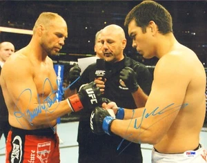 LYOTO MACHIDA RANDY COUTURE SIGNED AUTO'D 11X14 PHOTO PSA/DNA COA UFC 129 CHAMP - Picture 1 of 1