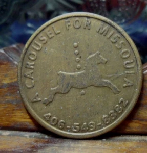 KARUSSELL FÜR MUSSOULA RIDE TOKEN KLCY TALK RADO AM 930 auf REVERSE - Bild 1 von 2