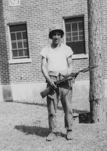 Handsome Man Holding Rifle Military Helmet Trees Building 1940s - Picture 1 of 3