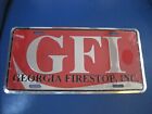 NOS GFI Georgia Firestop, INC. Metal booster license plate