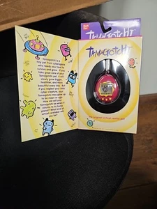 BANDAI ORIGINAL 1997 GEN 1 TAMAGOTCHI MASCOTA VIRTUAL ROSA/AMARILLO NUEVO SELLADO - Imagen 1 de 4
